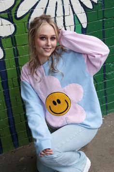 The Happy Flower Jumper! A super fun half and half bodice just to mix things up. Complete with large Pink Fleece Flower and Yellow Chenille Smiley Face for the centre. Hand sewn on with playful thick thread. Alternate coloured Sleeves!! What a great addition to your weird and wonderful Wardrobe. Bringing lots of happy happy vibes! Very 90s!  STYLING TIPS: Looks great matched with Denim Jeans and Trainers. Have the coolest hangover Sweatshirt at a Festival or chuck it on down at the beach. So man Playful Patchwork Crew Neck Top, Fun Patchwork Tops For Spring, Fun Patchwork Spring Tops, Flower Smiley Face, Flower Jumper, Oversized Jumper Dress, Flower Smiley, Face Sweating, Thick Thread