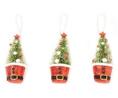 three small christmas trees with santa hats hanging from each one's side, all decorated in red and white