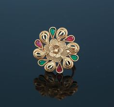 This gold plated designer finger ring is in floral design with petals. Center stone as ruby bead and petals decorated with teardrop clear cz stones. this is an adjustable ring and mostly fit for any finger size. Designer Gold Rings, Gold Rings For Women, Indian Rings, American Diamond Necklaces, Ruby Beads, Party Rings, Cz Jewelry, American Diamond, Design Silver