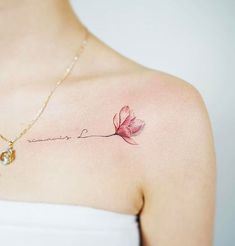 a woman's chest with a pink flower and the words love written on it