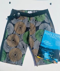 Cut, Styled and Made in Nigeria. Packaged in California Classic Fit for All Occasions. Beach, Casual, Golf. Black Side fabric Detail  Side Pocket detail Back pocket detail  Drawstring and Button closure 100 percent Cotton. Available in Sizes 34,38, and 40 Stretch Knee-length Beach Shorts, Summer Shorts With Button Closure, Summer Vacation Shorts With Button Closure, Stretch Shorts With Button Closure, Fitted Vacation Shorts, Beach Shorts With Buttons, Fitted Bermuda Shorts For Beach, Fitted Bermuda Shorts For The Beach, Summer Beach Shorts With Buttons