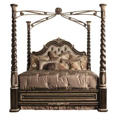 a bed that is made up and has pillows on top of the headboard,