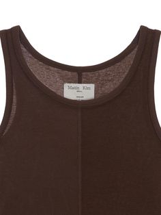 This is a casual and feminine top by Matin Kim that is made out of high quality and sturdy material. With distinctive mood of the design and comfortable wear, you can style it for your casual summer outfit.- Minimal metal embellishment detail- Basic and simple mood- Light fabric for summer season Brown Cotton Summer Tank Top, Brown Cotton Tank Top For Summer, Sleeveless Brown Cotton Top, Summer Brown Cotton Tank Top, Brown Sleeveless Cotton Top, Brown Sleeveless Tank Top For Layering, Brown Cotton Tank Top For Spring, Brown Sleeveless Top For Spring, Spring Brown Cotton Tank Top