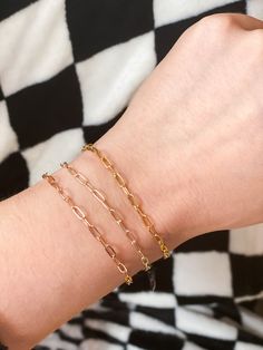 This thick and bold Rectangle Chain Bracelet is perfect for layering and stacking, allowing you to create a unique and personalized look. Its timeless design is both subtle and striking, with a three-dimensional shape that adds depth and shimmer. Versatile and unisex, these robust chain bracelets can be doubled, layered, or even worn as anklets, giving you endless possibilities to explore. CHOOSE FROM: Small | 6-6.5" Medium | 7-7.5" Large | 8-8.5" Chain comes with a lobster clasp and 1/2" extend Three Dimensional Shapes, Chain Bracelets, Knot Ring, Gold Bracelet Chain, Custom Bracelets, Cuff Bangles, Adjustable Bracelet, Endless Possibilities, Chain Bracelet