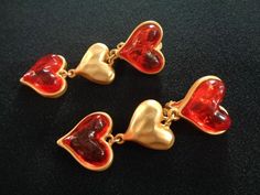 "Fabulous ESCADA Modern-Vintage Matte Finish Gold Tone Metal With Red Color Resin Acrylic Lucite Glass Puffed Heart Clip on Back Dangle Drop Earrings Romantic Valentine's Day Designer Fashion Jewelry Measures approx: 2-7/8\" long by 1\" at the widest point. Excellent Like NEW condition very beautiful clean and ready to wear!! For more brand names of vintage jewelry accessories please see our \"High End Vintage Jewelry\" Shop Section: https://www.etsy.com/shop/lizystuff?section_id=12189340 Please Red Heart-shaped Earrings For Formal Occasion, Vintage Double Heart Earrings, Vintage Red Heart Earrings For Gift, Vintage Red Heart Earrings As Gift, Red Vintage Heart Earrings For Gift, Red Vintage Heart Earrings For Gifting, Vintage Heart Earrings For Valentine's Day, Vintage Earrings For Valentine's Day Anniversary, Vintage Heart Earrings For Wedding