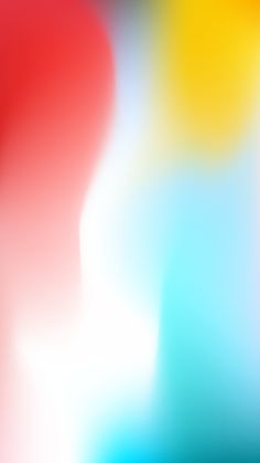 an abstract blurry background with red, yellow and blue colors