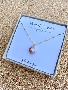 This necklace features a beautiful Edison Pearl drop floating on a satellite chain.PLEASE NOTE: The freshwater Edison Pearls will vary in shape, size and color and will have natural occurring birthmarks. The pearls will range and measure from 10mm to 12mm. These are stock photos, the necklace you receive will be similar but different. All White Sand Jewelry is handcrafted in Hawaii and comes in a hand stamped gift box ready for gifting. White Drop Pearl Necklace Gift, Dainty White Pearl Necklace With Satellite Chain, Delicate White Pearl Necklace With Satellite Chain, Edison Pearl Necklace, Saturn Pearl Necklace, Sand Jewelry, Virgin Mary Necklace, Vintage Choker Necklace, Pink Pearl Necklace