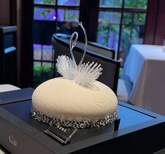 a white cake sitting on top of a table