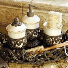 a bathroom set with soap dispenser and brush