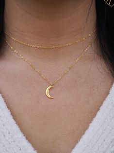 Gift this necklace to someone who needs a bit of extra glow in their world.The Moon lights up romantic evenings, pulls at the ocean tides, and represents the strength and clarity of our inner and outer worlds.Pendant measures: 14mm tall x 5mm wide. Options:1. Solid Sterling Silver .925 necklace chain and pendant.2. 14/20 Gold Filled necklace chain with 18k gold-plated pendant. WHAT LENGTH CHAIN DO I NEED?Simulate the length by draping a piece of yarn or string around your neck and bringing it to Celestial Style Necklace With Moon Charm, Celestial Moon Jewelry For Meditation, Celestial Moon-shaped Jewelry For Meditation, Magical Moon Shaped Sterling Silver Necklace, Adjustable Magical Moon Phase Jewelry, Dainty Moon-shaped Clavicle Chain Jewelry, Celestial Half Moon Jewelry Gift, Dainty Moon Shaped Clavicle Chain Jewelry, Magical Moon-shaped Sterling Silver Necklace