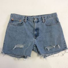 These weathered, vintage jeans have been cut to short  length, and distressed.  Vintage Ralph Lauren RL brand. The waist measures 33 inches around and the hips measure 41 inches around.  The inseam is 4 inches long.  The thighs measure 24 inches around.   Find more handmade clothing & accessories at:  dinwiddies.etsy.com Find  unique items for the home at:  dinwiddieshome.etsy.com www.dinwiddies.blogspot.com Retro Ripped Light Wash Bottoms, Retro Ripped Medium Wash Bottoms, Vintage Ripped Short Bottoms, Vintage Distressed Denim Shorts, Vintage Denim Blue Jean Shorts With Frayed Hem, Vintage Ripped Cutoff Jean Shorts, Vintage Denim Blue Cutoff Jean Shorts, Vintage Cutoff Denim Blue Jean Shorts, Distressed Medium Wash Short Leg Jeans