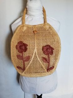 Vintage Clothing, Womens 70s Handbag, 1970s Purse, Accessories, Festival Outfit, Bohemain Fashion, Boho Style, Bag, Tote, Straw, Tan, Floral Gorgeous 1970's bohemian style top handle woven tote- perfect for carrying all the necessities on a night out on the town, or during the day on a coffee run. Features two adorable large flowers on the front.  Both are in excellent condition.  Simple button close at the top.  Button is wooden, and secure. One large compartment. Handles are large enough to be carried on your shoulder instead.   No materials are listed, but it feels like straw and/or burlap. Mint condition- no holes, stains or odors. Measurements: Length (including handles):  21 inches Width:  13 inches For vintage styling inspiration and ideas, please visit my Vintage Style mood board. Vintage Beige Satchel Hobo Bag, Vintage Beige Hobo Shoulder Bag, Vintage Summer Shoulder Bag, Vintage Beige Hobo Tote Bag, Vintage Summer Tote Shoulder Bag, Vintage Summer Satchel Straw Bag, Vintage Straw Bag For Daily Use, Vintage Summer Straw Satchel Bag, Vintage Satchel Straw Bag For Summer