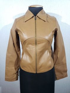 Women's sports leather jacket. Reliable women's brown jacket with a zipper made of genuine leather. The jacket is made of durable brown genuine leather. A great leather jacket for women who prefer an active lifestyle. The jacket fastens with a metal zipper. The jacket has two pockets at the bottom. The sleeves of the jacket have decorative leather laces. The jacket has a good polyester lining. The jacket is light and comfortable, which allows you to be active and move a lot without tension. A light shade of brown will give you charm and playfulness. MEASUREMENTS Jacket length                    53 cm  |  21 in Pit to pit                            45 cm  |  17.5 in Chest  circumference        90 cm  |  35.5 in                                                             Waist  circumference Fitted Brown Biker Leather Jacket, Fitted Brown Leather Biker Jacket, Brown Leather Jacket With Zipper For Fall, Fitted Brown Leather Jacket With Long Sleeves, Fitted Vintage Brown Leather Winter Jacket, Vintage Brown Leather Biker Jacket With Long Sleeves, Fitted Vintage Brown Leather Jacket For Winter, Brown Fitted Long Sleeve Leather Jacket, Brown Biker Leather Jacket With Zipper Closure