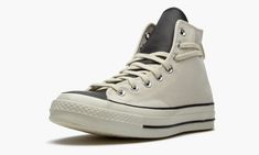 The Fear of God x Converse Chuck 70 Hi “Natural” is one of several versatile colorways of the high-top shoe imagined by the California based fashion brand.  Released as part of Fear of God’s Essentials line for Spring 2020, the Converse Chuck 70 Hi “Natural” incorporates an added lace loop on the heel of its design for a modern update on the timeless silhouette.  The upper features a thicker variety of vintage-inspired cream or “Natural” canvas, an upgrade built exclusively for the Chuck 70.  Me Natural Shoes, High Top Shoe, Converse Chuck 70, Naturalizer Shoes, Stadium Goods, Chuck 70, Fear Of God, The Fear, Cream Lace