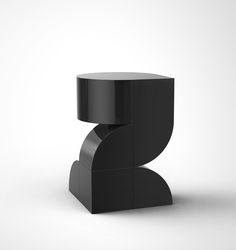 a black table with an unusual shape on the top and bottom, against a white background