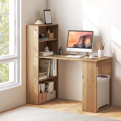 a wooden desk with a computer on top of it next to a book shelf and window