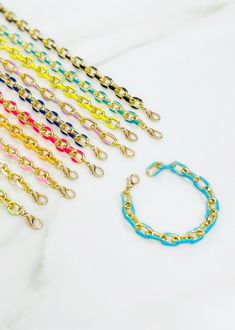 These enamel neon chain bracelets are a fan favorite. They add a pop of color to any look and look amazing styled with other bracelets or on their own. The Details 7” Enamel Gold Plated Chain Lobster Closure Enamel Chain Link Bracelet Trendy Adjustable Multicolor Chain Bracelet, Trendy Multicolor Adjustable Chain Bracelet, Multicolor Adjustable Chain Bracelet, Trendy Multicolor Chain Bracelet For Gift, Trendy Blue Bracelets With Adjustable Chain, Adjustable Blue Chain Bracelet, Multicolor Chain Bracelets As Gift, Trendy Multicolor Chain Bracelets, Trendy Multicolor Chain Bracelet