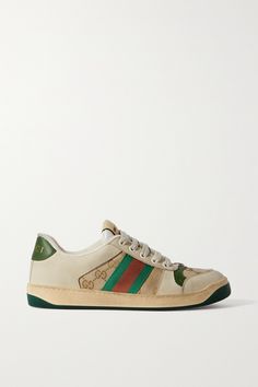 Gucci's 'Screener' sneakers are modeled after '70s styles and named after a basketball play. This perforated pair has been made in Italy from leather and suede that's been heavily distressed to resemble original sports shoes from the era. They're detailed with logo plaques and the house's signature striped webbing. Gucci Green Sneakers With Rubber Sole, Gucci Leather Sneakers With Embroidered Logo, Gucci Custom Sneakers With Branded Heel Counter, Vintage Low-top Sneakers With Embroidered Logo, Sporty Gucci Leather Custom Sneakers, Sporty Gucci Sneakers With Embroidered Logo, Gucci Low-top Sneakers With Perforated Toe Box, Gucci Leather Sneakers With Perforated Toe Box, Gucci Lace-up Sneakers With Perforations