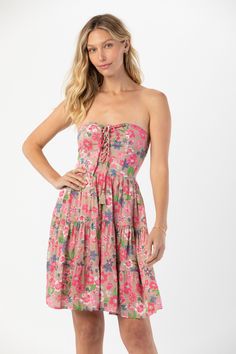 Twirl into your next island getaway in the Perth Mini Dress. Featuring light, rayon fabric, this flowy mini dress offers versatile style that brings big vibes and smiles to Summer. Designed with curves in mind, you’ll love the way this strapless, tiered mini contours with comfort and adjusts to your style and individuality. Details: 100% rayon Hand wash cold & Lay flat to dry Features: Unlined, Strapless self tie bodice, Smocked back for adjustable fit, Lace up detail with tassel ties, Tiered mi