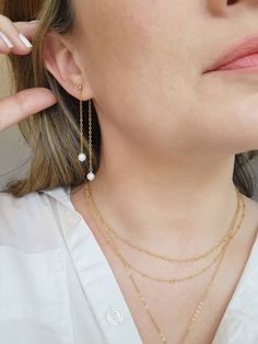 The sparkle on these double chain Pearl earrings could light up even the darkest room! Two natural Pearls swing on shimmery chain from each tiny stud. The earring post may be removed to wear on other stud earrings! ✨Details✨ * 3mm 14K Gold Filled or 925 Sterling Silver ball stud and accents * 2.75 inch length * 5mm genuine Pearls * 14/20 gf or 925 stamp for authenticity * Made with all hypoallergenic materials 🤍 * Sold as a pair Matching Necklace: https://etsy.me/42AkSCC ✨ Shop all Pearl earrin 14k Gold Filled Dangle Jewelry With Delicate Chain, Everyday 14k Gold Dangle Pearl Earrings, Dainty Long Drop Pearl Earrings For Everyday, 14k Gold Dangle Linear Earrings With Pearl Drop, Everyday Dainty Dangle Linear Earrings, 14k Gold Filled Dangle Linear Earrings For Everyday, Everyday 14k Gold Filled Dangle Linear Earrings, Fine Jewelry With Delicate Long Drop Chain, Everyday 14k Gold-filled Dangle Linear Earrings