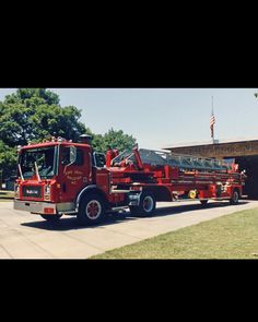 two fire trucks parked in front of a building