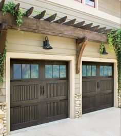 two brown garage doors with plants growing on the side of them and attached to a pergolated trellis