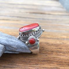 Red coral set on traditional Tibetan saddle Ring - Center coral measures approximately;  21mm X 12mm Smaller corals on the sides measures approximately 6mm Height of the ring is approximately 29mm , width  27mm Adjustable size fits sizes  9 to 10 1/2 It weights approximately 18 grams Red Coral Ring, Saddle Ring, Coral Ring, Red Coral, Last Minute Gifts, Rings Statement, Statement Rings, Jewelry Rings, Coral