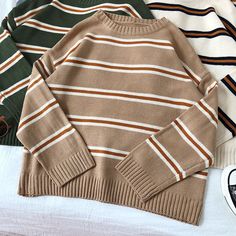 SPECIFICATIONSYear / Season: Winter Of 2020Yarn Thickness: Coarse yarnThickness: STANDARDStyle: vintageSleeve Style: RegularSleeve Length(cm): FullSleeve Length: Long SleevesSeason: Spring/AutumnPercentage of Material: 51%-70%Pattern Type: stripedPattern: Loose-fittingPattern: StripeOrigin: CN(Origin)Model Number: tbsc045Material Composition: acrylicMaterial: nylon,PolyesterGender: WOMENCollar: Crew NeckCollar: O-NeckClothing Length: RegularBrand Name: FTLZZAge: Ages 18-35 Years Old Oversized Striped Long Sleeve Sweater, Oversized Beige Crew Neck Sweater, Retro Beige Knitted Sweater, Beige Knitted Retro Sweater, Oversized Striped Sweater For Fall, Retro Beige Knit Sweater, Beige Long Sleeve Retro Sweater, Brown Oversized Vintage Sweater, Oversized Brown Vintage Sweater