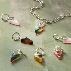 several different colored glass pieces on a silver chain