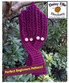 a purple knitted scarf with buttons on it and the words perfect beginners pattern