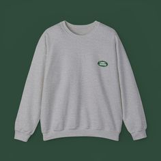 Channel your love for classic Land Rovers and cozy comfort with the Land Rover Vintage Styled, Unisex Heavy Blend™ Crewneck Sweatshirt. This sweatshirt is perfect for any Land Rover enthusiast or anyone who appreciates a vintage aesthetic. Here's what makes it stand out: Vintage-inspired Land Rover design: The sweatshirt features a vintage-styled Land Rover graphic that will turn heads and spark conversations. Unisex and comfortable: This crewneck sweatshirt is designed to fit everyone comfortably. It's made from a medium-weight blend of 50% cotton and 50% polyester, making it soft, cozy, and ideal for those cooler days. Built to last: The sweatshirt boasts double-needle stitching at the shoulder, armhole, neck, waistband, and cuff seams for long-lasting durability. Classic fit and clean s Cozy Heather Grey Crew Neck Sweater, Basic Gray Crew Neck Sweater, Heather Grey Crew Neck Casual Sweater, Cozy Heather Grey Crew Neck Sweatshirt, Classic Cotton Sweatshirt With Letter Print, Casual Heather Grey Crew Neck Sweater, Basic Gray Crew Neck Sweatshirt, Classic Gray Crew Neck Sweatshirt, Classic Crew Neck Sweatshirt With Letter Print