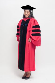 a woman in a graduation gown and cap smiles for the camera while standing against a white background