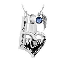 a heart shaped necklace with two charms on it