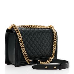 This is an authentic CHANEL Calfskin Quilted New Medium Boy Flap in Black. This stylish shoulder bag is crafted of diamond-quilted calfskin leather in black with linear quilted borders. The bag features an aged gold chainlink shoulder strap with a leather shoulder pad and an aged gold boy CC push lock on the crossover flap. This opens to a black fabric interior with zipper and patch pockets. Stylish Shoulder Bag, Diamond Quilt, New Media, Fashion History, Black Fabric, Chanel Bag, Shoulder Pads, Classic Black, Chain Link