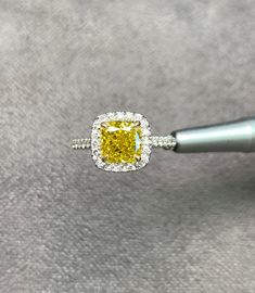 Diamond Engagement Ring, 2.11 Carat GIA Cushion Cut Diamond, Diamond Ring, Engagement Ring, GIA Diamond Fancy Vivid Yellow Diamond, 18k Gold Gold metal: 18K White gold Diamond Shape: Cushion Cut Main Stone: 1.76 Ct Side Stones: 0.35 Carats Total Carat Weight: 2.11 Ct Color: Fancy Vivid Yellow Treated HPHT Clarity: VVS2 Comments: Natural Diamond HPHT Side Stones Clarity: VVS Side Stones Color: E-F Cut: Excellent All products come with a Certificate. Please feel free to contact me for any question Diamond Ring Engagement, Cushion Cut Diamond, Cushion Cut Diamonds, Ring Engagement, Yellow Diamond, Diamond Shape, Gia Diamond, Gold Gold, Cushion Cut