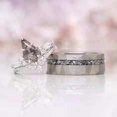 two wedding rings with diamonds on them