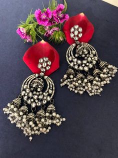 Step out in style with this beautiful oxidised silver plated earrings, which have been given a drop designer dangler perfectly designed. It will add bling to your look. This earring will go well with any of your ethnic outfits. Earring Indian, Earrings Stone, Chandbali Earrings, Jhumki Earrings, Party Kleidung, Ethnic Outfits, Pearl Earring, Stone Studs, Big Earrings