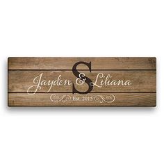 a wooden sign with the letter s and an initial on it that says, lauren & ll