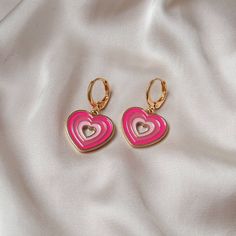 Don't miss out on these beautiful gold plated and pink retro heart drop earrings. They work with a large variety of looks and add a bit of sparkle to your outfit. Dimensions: Drop Length - 3cm Width - 2.8cm MORE jewellery pieces available on our shop! Any questions please message we are happy to help. Free postage in UK Thank you for shopping with us Heather&Bumble 📪Follow us at: Instagram: heatherandbumble Twitter: Heather_Bumble Pintrest: Heather & Bumble Pink & Gold Retro Heart Drop Earrings -  70's Style Earrings, Vintage Style, Hanging Jewellery,Accessories,Pink Jewellery,Gold Earrings Pink Heart Charm Hoop Earrings For Valentine's Day, Pink Hoop Earrings With Heart Charm For Valentine's Day, Pink Pierced Earrings As Gift, Retro Jewelry For Valentine's Day Party, Pink Heart-shaped Hoop Earrings For Gifts, Pink Dangle Hoop Earrings For Valentine's Day, Pink Heart Hoop Earrings For Gift, Pink Heart Hoop Earrings As Gift, Retro Pink Earrings For Party