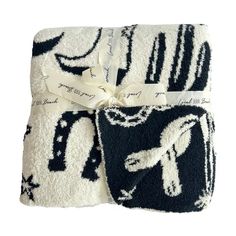 three towels with black and white designs on them