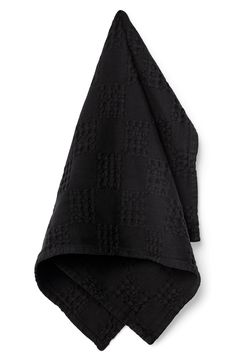 a black towel folded on top of each other