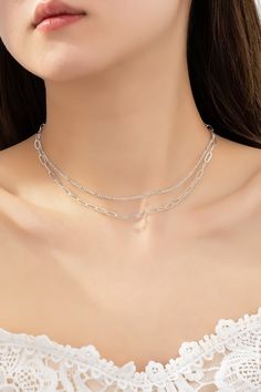 Two Layer Minimalist Chain Necklace In Silver - Infinity Raine Chic Silver Clavicle Chain Necklace, Chic Silver Double Chain Necklace, Chic Silver Layered Metal Necklace, Chic Silver Layered Chain Necklace, Chic Silver Layered Necklace For Gift, Minimalist Metal Layered Necklace With Clavicle Chain, Chic Silver Layered Necklace With Adjustable Chain, Silver Double Strand Layered Necklace For Everyday, Silver Layered Necklace For Everyday