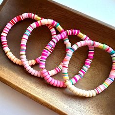 💞One of a kind & ready to ship💞  Set of three stretch bracelets in complimenting colors. All bracelets are made "one size fits most".  I make these in ANY and ALL colors for your child's teams, college, pro team, sorority, place of work, or just any of your favorites. Please message me so we can talk colors!  *Smoke and pet free home!* I ship 6 days a week! Thank you for browsing my store! Style: BD-RT-R Pink Heishi Beads Stretch Bracelet Stackable, Pink Stackable Heishi Beads Stretch Bracelet, Playful Pink Heishi Beads Bracelets, Pink Heishi Beads Stretch Bracelet For Friendship, Playful Pink Heishi Beads Stretch Bracelet, Playful Pink Heishi Beads Bracelet, Complimenting Colors, Tropical Neon, Pink Holiday