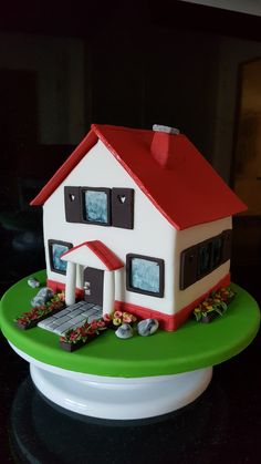 a cake with a house on top of it