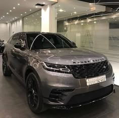 the new range rover is on display at an automobile showroom