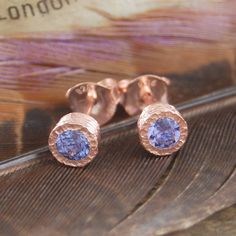 Tanzanite Rose Gold December Birthstone Stud Earrings - These stunning 18k rose gold vermeil earrings feature two 0.25 carat faceted genuine Tanzanite stones set into gently textured bezels. #Embersjewellery #Jewellery #Valentine #Valentinesday #PersonalisedGift #ForHer December Birthstone Necklace, Tanzanite Studs, Dainty Pendant Necklace, December Birthstone Jewelry, Tanzanite Necklace, Dandelion Wish, Tanzanite Earrings, Tanzanite Stone, Rose Gold Studs