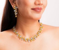 Canary yellow diamond necklace featuring yellow stones and cz diamonds. Perfect for any special occasion look or bride wedding look. It will enhance your look and add a touch of luxury ness in your look. *𝐏𝐑𝐎𝐃𝐔𝐂𝐓 𝐃𝐄𝐓𝐀𝐈𝐋* * 𝐌𝐚𝐭𝐞𝐫𝐢𝐚𝐥: Brass * 𝐏𝐥𝐚𝐭𝐢𝐧𝐠: White Rhodium Plated * 𝐒𝐭𝐨𝐧𝐞: AAA-quality CZ Diamond & Canary. *𝐃𝐈𝐌𝐄𝐍𝐒𝐈𝐎𝐍𝐒* *𝐍𝐞𝐜𝐤𝐥𝐚𝐜𝐞* * 𝐖𝐞𝐢𝐠𝐡𝐭: 83 gm  * 𝐃𝐫𝐨𝐩 𝐋𝐞𝐧𝐠𝐭𝐡: 5.5 Inches * 𝐖𝐢𝐝𝐭𝐡:  0.7 Inches *𝐄𝐚𝐫𝐫𝐢𝐧𝐠𝐬* * 𝐖𝐞𝐢 Elegant Yellow Bridal Necklace For Party, Formal Yellow Jewelry With Single Cut Diamonds, Elegant Yellow Bridal Necklace For Formal Occasions, Elegant Yellow Jewelry With Single Cut Diamonds, Luxury Yellow Cubic Zirconia Necklaces, Yellow Diamond Jewelry With Single Cut Diamonds, Wedding Yellow Gold Diamond Necklace With Sparkling Stones, Luxury Yellow Jewelry For Wedding, Luxury Yellow Wedding Jewelry