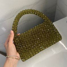 This unique handbag is meticulously designed and crafted with inspiration from nature. Each bead is carefully selected and the bag is entirely hand-stitched. Green crystals symbolize the tranquility and energy of nature. Features: - 🌿 Material: High-quality green crystal beads, durable stitching. - 🌿 Dimensions: Medium : 18cm x 22cm Large : 21cm x 22cm ( size in picture Large size) - 🌿 Use: Perfect for daily use and to complement your style on special occasions. Why Choose This Bag? - 🌿 Uniq Green Beaded Bag, Green Beaded Pouch Shoulder Bag, Green Beaded Rectangular Bag, Green Beaded Rectangular Evening Bag, Green Beaded Bags For Daily Use, Green Beaded Shoulder Bag For Daily Use, Green Square Beaded Bag, Handmade Green Rectangular Evening Bag, Cristal Bag