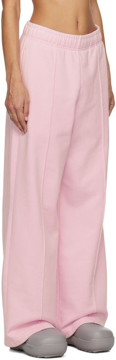 French Terry sweatpants. · Concealed drawstring at elasticized waistband · Two-pocket styling · Logo embroidered at front · Pinched seams at legs Supplier color: Baby pink Pink Sweatpants With Pockets, Wide Leg, Pink Wide-leg Sweatpants With Pockets, Pink Wide Leg Joggers For Spring, Pink Wide Leg Spring Joggers, Pink Wide-leg Spring Joggers, Pink Cotton Pants With Elastic Cuffs, Pink Wide Leg Sweatpants With Pockets, Pink Bottoms With Elastic Cuffs For Spring, Pink Wide Leg Sweatpants Athleisure Style