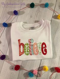 This is one of our favorite new Christmas shirts. The word "Believe" is applique with embroidery accents. Materials used may not be exactly as pictured but will be similar colors and patterns. We use boutique quality shirts from ARB Blanks or Blossom Blanks depending on availability. All of our embroidered shirts feature Cloud Cover on the back side to protect your child's skin for a rough surface. Available Shirt Sizes: 12 months through 8 See pictures for sizing charts. Need somethin Christmas Shirt Boys, Girls Christmas Shirts, Customised Denim Jacket, Boys Christmas Shirt, Christmas Believe, Applique Letters, Christmas Shirts For Kids, Believe Christmas, Embroidered Shirts